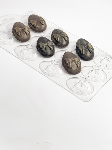 Набор к пасхе Яйцо с бантом 12 ячеек форма пластиковая — ANYMOLDS ПРОИЗВОДСТВО ПЛАСТИКОВЫХ ФОРМ ДЛЯ МЫЛА, ШОКОЛАДА, ГИПСА